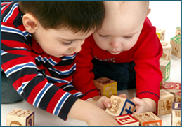Two Kids Playing Building Blocks